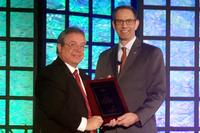 David Raby with an IPC President’s Award.